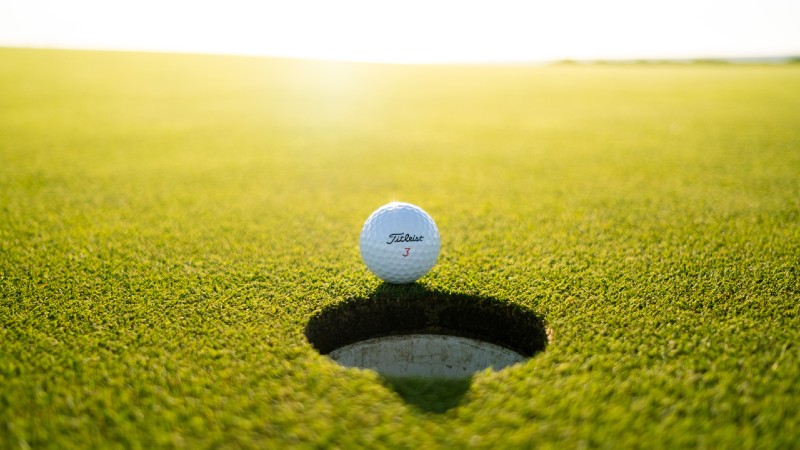 Golf ball near cup