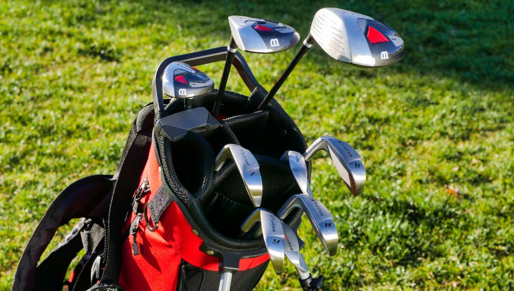 Some 3-wood and 5-wood golf clubs in the golf bag