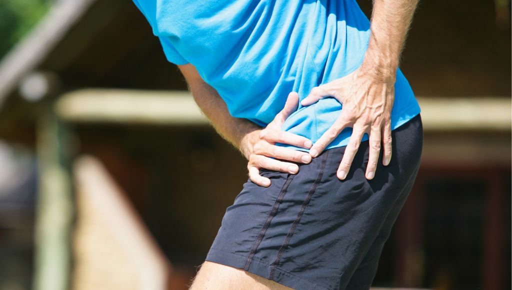 A male person having severe hip pain